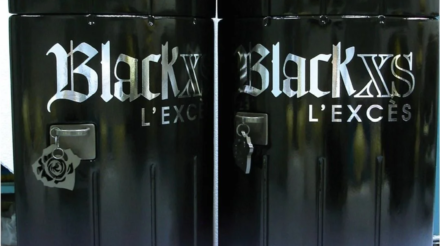 Large Black XS perfume bottle promotional installation created by CORNARI.