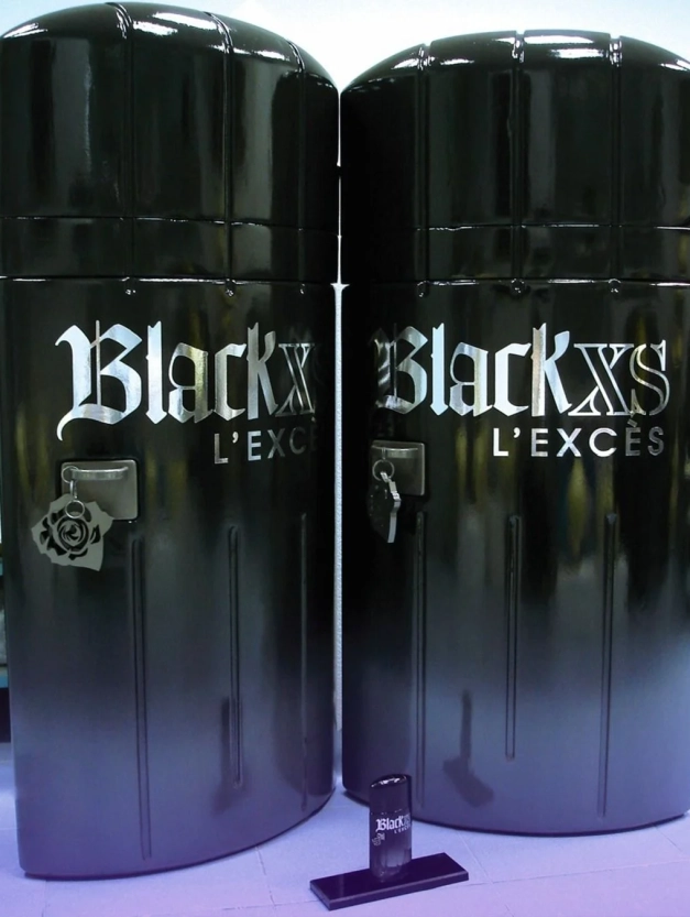Large Black XS perfume bottle promotional installation created by CORNARI.