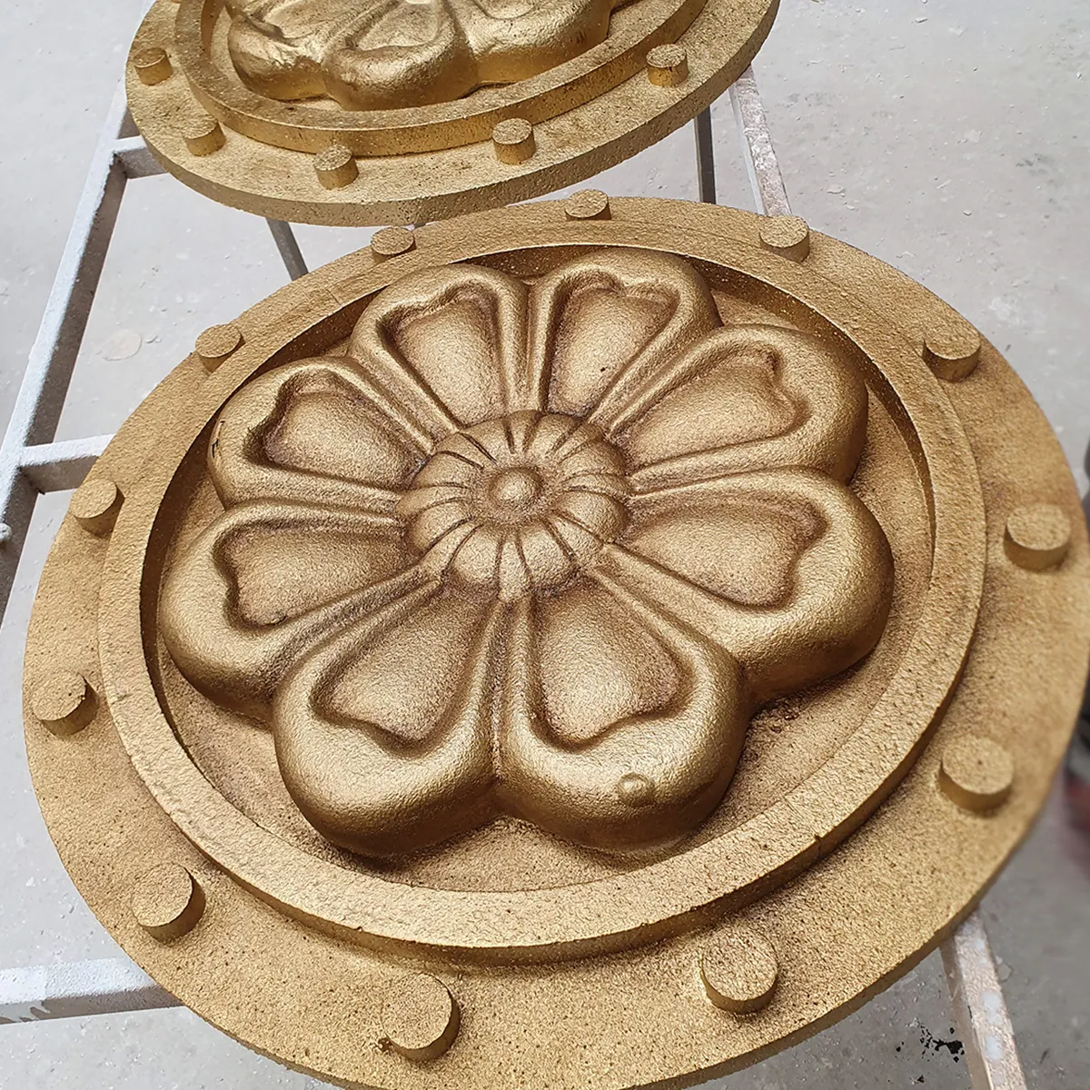 Golden flower sculpture for luxury interior and event decoration.
